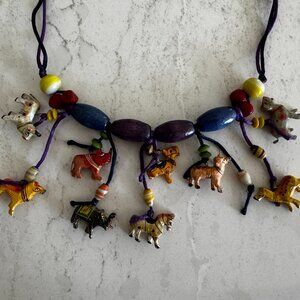 Necklace with beads and exotic animals